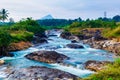 The fast flowing Waterfall located near the Pechiparai Dam The water flows over a rocky cliff. Royalty Free Stock Photo