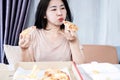 fast food addiction with Asian woman overeating pizza, Binge eating disorder concep