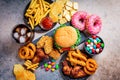 Fast food assortment. Junk food concept. Unhealthy food for the heart, teeth, skin, figure