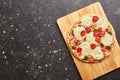 Fast food baked frozen pizza with cheese, tomatoes and pesto. Ready to eat. Royalty Free Stock Photo