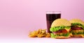 Fast food banner. Juicy meat burgers, french fries potatoes and cola drink on pink background. Take away meal. Unhealthy diet Royalty Free Stock Photo