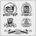 Fast food and BBQ grill labels, emblems and design elements. Burgers, pizza, hot dog and fries. Royalty Free Stock Photo