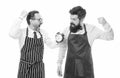 fast food. bearded men with alarm clock. lunch time. catering business. men competition in cooking. chef team in apron Royalty Free Stock Photo