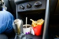 Fast Food in a car: cold beverage and delicious fries