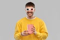 Happy man 3d movie glasses with popcorn in bucket Royalty Free Stock Photo