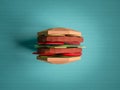 Fast food concept. Burger from cardboard on blue background. Car