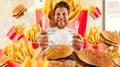 Fast food concept, man and burgers with fries Royalty Free Stock Photo