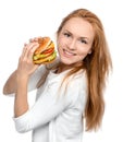Fast food concept. Tasty unhealthy burger sandwich in hands hung Royalty Free Stock Photo