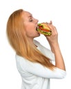 Fast food concept. Woman eating tasty unhealthy burger sandwich Royalty Free Stock Photo