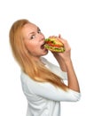 Fast food concept. Woman eating tasty unhealthy burger sandwich Royalty Free Stock Photo