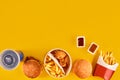 Fast food dish top view. Meat burger, potato chips and wedges. Take away composition. French fries, hamburger
