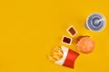 Fast food dish top view. Meat burger, potato chips and wedges. Take away composition. French fries, hamburger