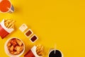 Fast food dish on yellow background. Fast food set fried chicken and french fries. Take away fast food. Royalty Free Stock Photo