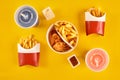 Fast food dish on yellow background. Fast food set fried chicken and french fries. Take away fast food. Royalty Free Stock Photo