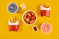 Fast food dish on yellow background. Fast food set fried chicken and french fries. Take away fast food. Royalty Free Stock Photo