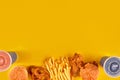 Fast food dish on yellow background. Fast food set fried chicken, meat burger and french fries. Take away fast food. Royalty Free Stock Photo