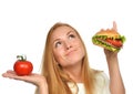 Fast food eating concept comparing burger sandwich in hand and t Royalty Free Stock Photo