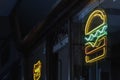 Fast food establishment with a hamburger neon sign