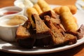 Fast food, Fresh beer snacks assortment. fried rye bread croutons and cheese sticks with sauces, beer plate in the cafe. Very