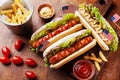 Fast food from hot dog with sausage and fries decorated USA flag on 4th july top view. Table setting on american independence day. Royalty Free Stock Photo