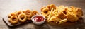 Fast food meals : onion rings, french fries, chicken nuggets and fried chicken