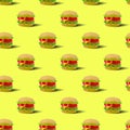 Fast food pattern plastic burger on a yellow background