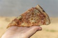 Fast food, pizza, on the beach Royalty Free Stock Photo