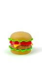 Fast food. A plastic hamburger. Isolated. White background Royalty Free Stock Photo