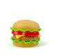 Fast food. A plastic hamburger. Isolated. White background Royalty Free Stock Photo