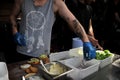 Fast food preparation of hamburgers in an outdoor market in London England Royalty Free Stock Photo