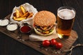 Fast food restaurant dish. Hamburger and fries wedges