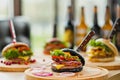 Fast food restaurant. Lots of different burgers and beer bottles on the table at the window restaurant. Royalty Free Stock Photo