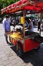 Fast food. Selling popcorn from a stall in the city.