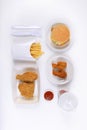 Fast food set containing burgers, fried chicken, french fries and soft drink isolated on white background Royalty Free Stock Photo