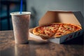 Fast food. Takeaway pizza in a cardboard box and a cup of coffee.