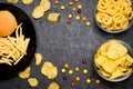 Fast food: top view of burger, french fries, chips, rings and ca