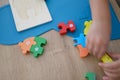 Fast kid hands playing with toy colourful puzzle Royalty Free Stock Photo