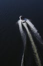 Fast motor boat on a dark blue water surface Royalty Free Stock Photo