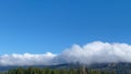 Fast mountain blue sky foggy clouds overcast moving weather cloudbank rolling fog