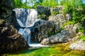 Fast mountain waterfall with clear spring water. beautiful view Royalty Free Stock Photo