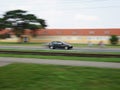 Fast moving black car with motion blur background