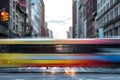 Fast moving bus leaves rainbow colored streaks in New York City Royalty Free Stock Photo