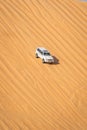 A fast moving car through desert during LIWA motor fest, moreeb dunes Royalty Free Stock Photo