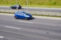 Fast moving car on a highway Royalty Free Stock Photo