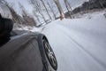 Fast moving car on a winter snowy road Royalty Free Stock Photo