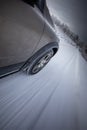 Fast moving car on a  snowy road Royalty Free Stock Photo