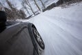 Fast moving car on a winter road Royalty Free Stock Photo