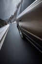 Fast moving car on a wintersnowy road Royalty Free Stock Photo