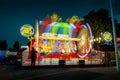 Fast moving fairground attraction at night in Sassenheim Royalty Free Stock Photo