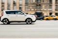 Fast moving gray car on the city road. Compact city hatchback is driving along the highway. Kia Soul on the city street in motion Royalty Free Stock Photo